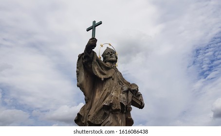 religious statue with dramatic sky