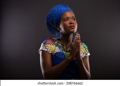 Religious Young African Woman Praying Over Black Background