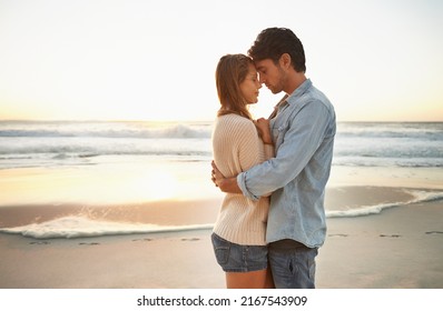 Relishing this moment. A blissful young couple celebrating their love at sunset on the be. - Powered by Shutterstock