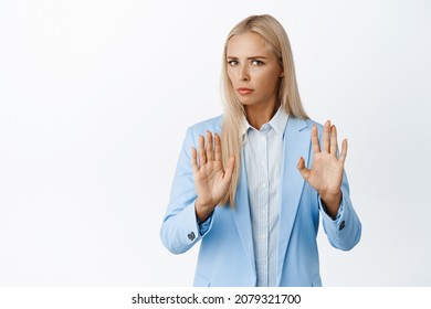 Reluctant Corporate Woman In Blue Suit Making Cross Taboo Gesture, Refusing Something, Decline Bad Offer, Standing Over White Background