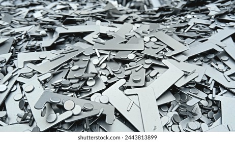The remaining aluminum from the production process is stored or collected in the trash can at the front of the factory.