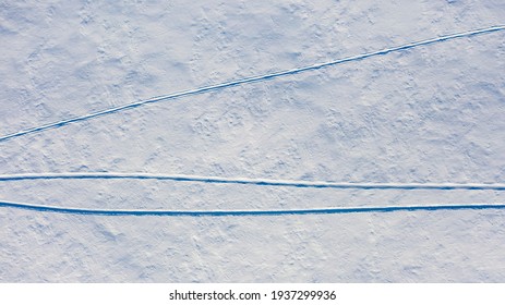 The Remaining Tracks In The Snow From A Snowmobile, Top View