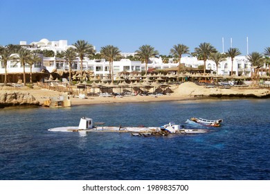 Remains Of Damaged Yacht After The Storm At Sea. Ship Wreck During Hurricane Medium Shot. Damaged Yacht Lying In Water Near Sea Shore Landscape View Image. Photo Of Broken Boat. Marine Crash Accident