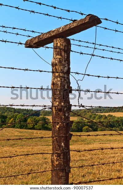 Remains of\
iron curtain near border of Czech republic and Austria. Iron\
curtain divided Europe in years\
1948-1989.