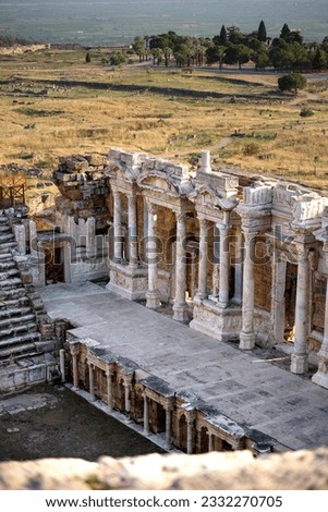 Remains of a large amphitheater in the ancient city of Hierapolis near Pamukkale, Denizli. Frescoes on the wall, columns, ancient Greek writings and a statue of a woman