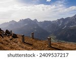 Remains of military bunker of First World War on mount Helm (Monte Elmo) with scenic view of mountain peaks of untamed Sexten Dolomites, South Tyrol, Italy, Europe. Wanderlust concept in Italian Alps