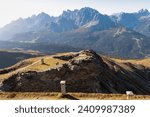 Remains of military bunker of First World War on mount Hornischegg with scenic view of mountain peaks of untamed Sexten Dolomites, South Tyrol, border Austria Italy, Europe. Wanderlust concept in Alps