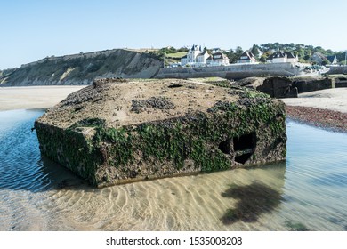 Remains of the Mulberry harbor on the beach in Arromanches (Gold Beach).