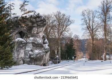 Remains of rock city in Adrspach Rocks, part of Adrspach-Teplice landscape park in Broumov Highlands region of Czech Republic. Winter amazing road through the rock town.