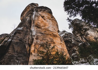 Remains of rock city in Adrspach Rocks, part of Adrspach-Teplice landscape park in Broumov Highlands region of Czech Republic. Winter amazing road through the rock town.