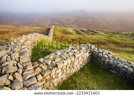Remains of Roman wall. Roman fort ruins at Hardknott Pass, Lake District, UK
