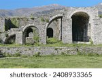 Remains of stepped arcade of four arches -in crescendo, alternately one half-sized, the next complete- made of stone block masonry on the upper-central courtyard of the fortress. Gjirokaster-Albania.