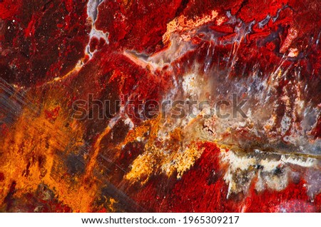 A remarkable multicolored jasper with patterns resembling those of watercolor drawing occurs in a deposit at Ural Mountains. Natural patterns and texture of slice of multicolored jasper stone surfaces