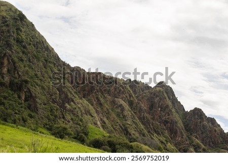 A remarkable view of a synclinal mountain formation in Tesalia, Huila, Colombia, featuring the intricate geological folding of rock layers. This image is perfect for geological studies, educational