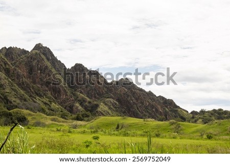 A remarkable view of a synclinal mountain formation in Tesalia, Huila, Colombia, featuring the intricate geological folding of rock layers. This image is perfect for geological studies, educational