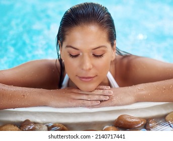 Remember To Pamper Yourself. Shot Of A Young Woman Relaxing At A Spa Pool.