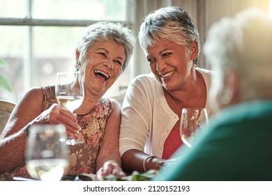 I remember those days. Cropped shot of a group of senior female friends enjoying a lunch date. - Powered by Shutterstock