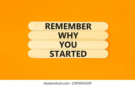 Remember why you started symbol. Concept word Remember why you started on beautiful wooden stick. Beautiful orange table orange background. Business remember why you started concept. Copy space. - Shutterstock ID 2395043109