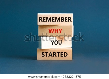 Remember why you started symbol. Concept word Remember why you started on wooden block. Beautiful grey table grey background. Business remember why you started concept. Copy space.