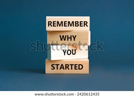 Remember why you started symbol. Concept word Remember why you started on wooden block. Beautiful grey table grey background. Business remember why you started concept. Copy space.