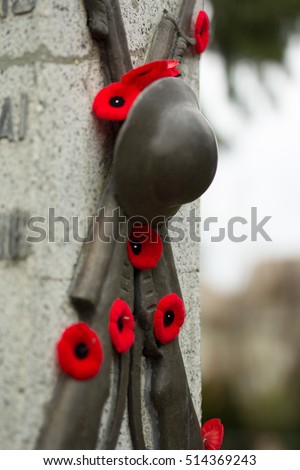Remembrance day in Canada. Red poppies on monument. 