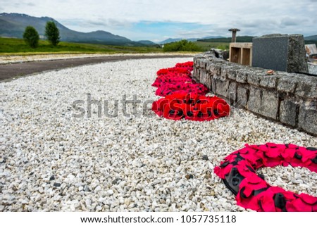 Remembrance day poppies laying close to the commando memorial in Spean bridge, Scotland - United Kingdom.
