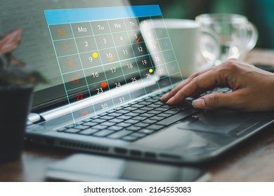 Reminder Appointment For Calendar And Organizer's Agenda Timetables And Agendas Used By Event Planners To Organize And Schedule Events. Lady Is Using Laptop Computer To Make Notes On Virtual Calendar.