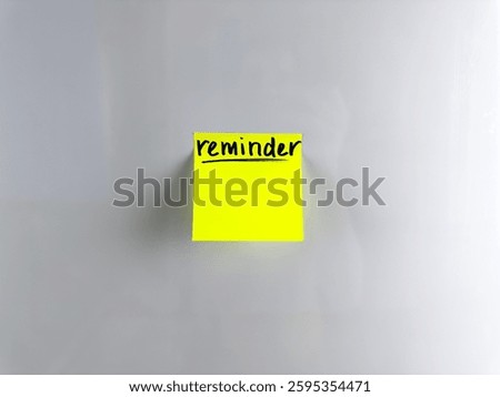Reminder concept. Write down important information on sticky note. Bright paper with marker writing for memorization. Staff to write down important information