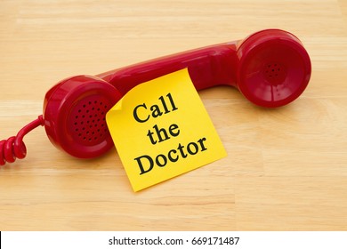 Reminder To Make An Appointment At The Your Doctor, Retro Red Phone Handset With A Yellow Sticky Note And Text Call The Doctor