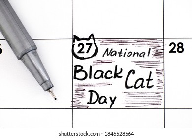 Reminder National Black Cat Day In Calendar With Pen. October 27. 