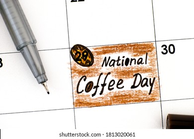 Reminder National Coffee Day In Calendar With Pen. September 29.