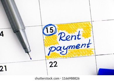 Reminder Rent Payment In Calendar With Blue Pen. Close-up.