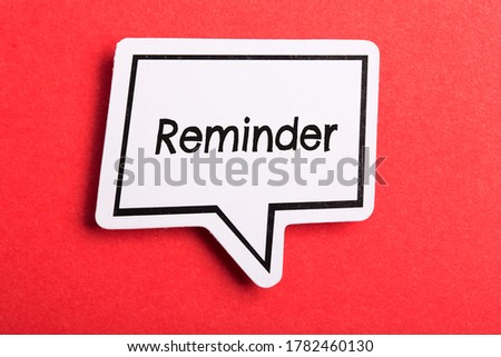 Reminder speech bubble isolated on the red background.