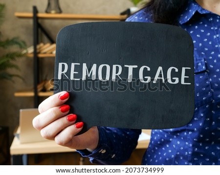  REMORTGAGE sign on the piece of paper. 

