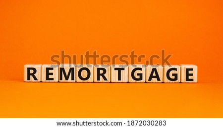 Remortgage symbol. 'Remortgage' written on wooden blocks. Business and remortgage concept. Copy space. Beautiful white background.