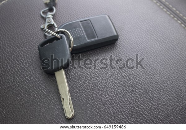 remote car key on \
leather\
sofa