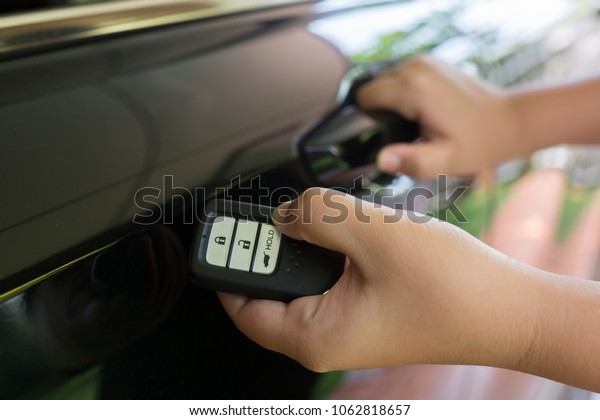 Remote car keys, and\
black car background
