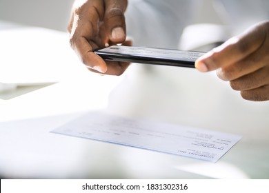 Remote Check Deposit Using Mobile Photo Scanning - Shutterstock ID 1831302316