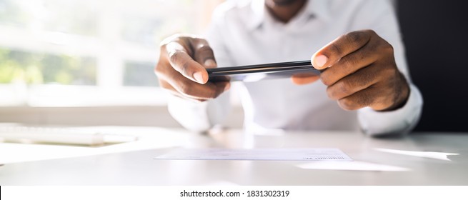 Remote Check Deposit Using Mobile Photo Scanning - Shutterstock ID 1831302319