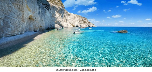 The remote coast at the Keri area, with shining, turquoise sea next to the steep cliffs at the Ionian island of Zakynthos, Greece