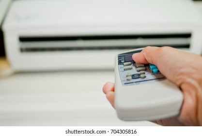remote control air condition - Shutterstock ID 704305816