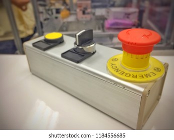 Remote control and emergency switch using in machine robot. Emergency switch and ON/OFF switch for control operation of machine. Remote Control Pendant use for control robot.Close up.