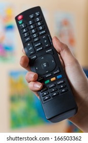 Remote control in hand  indoor photo