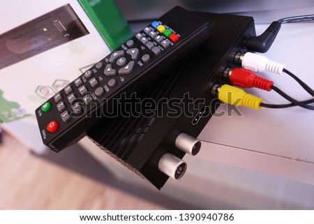 Remote control.  Set-top box for receiving video and TV signal. 