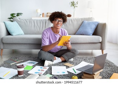 Remote Education. Cool Black Teen Guy Taking Notes During Online Class On Laptop At Home, Full Length. African American Youth Having Web Conference Or Consultation With Teacher