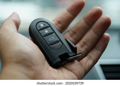 Remote Keyless System Car On A Palm Of  Hand