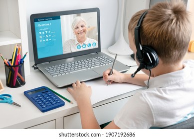 Remote learning concept with boy using laptop. E-learning, math exercise.