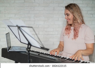 Remote Music Lessons. A Singing Teacher Records The Lesson On A Laptop Webcam.