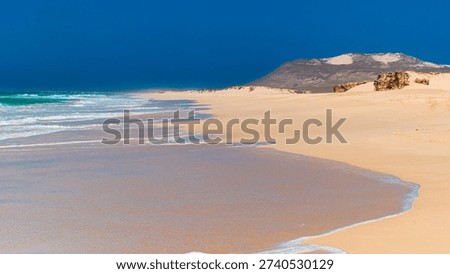 Remote sandy beach with ocean waves, Varadinha beach, Boa Vista, Cape Verde