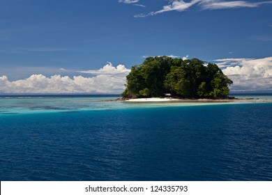 A Remote Tropical, South Pacific Island Is Surrounded By Clear Water And Diverse Coral Reefs In The Solomon Islands.